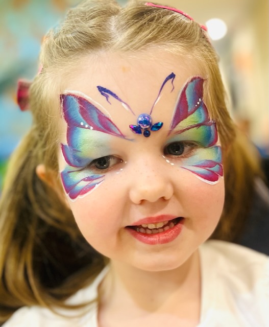 Girl with butterfly face paint in Telford